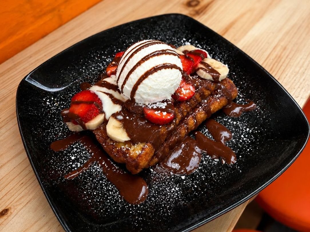 French toast with strawberries, banana and chocolate sauce